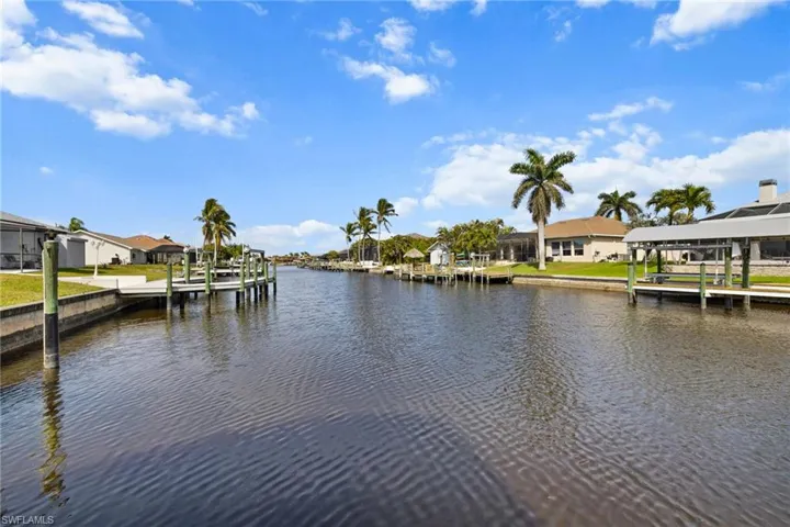 Dock area featuring a residential view and a water view