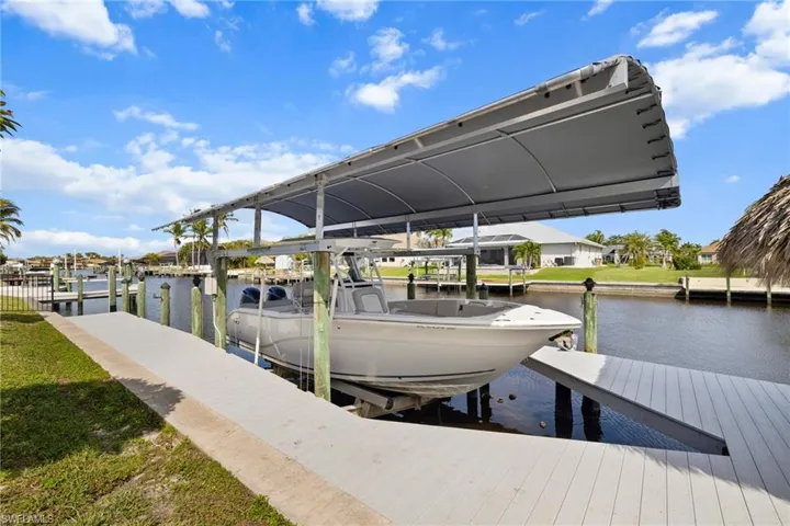 View of dock featuring a water view and boat lift