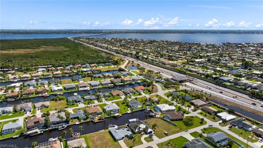 Aerial view with a residential view and a water view