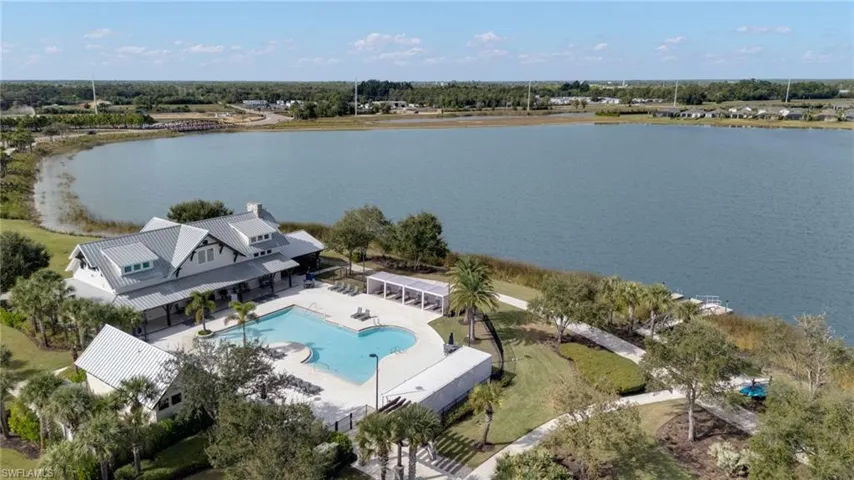Bird's eye view of a pool area and a large body of water