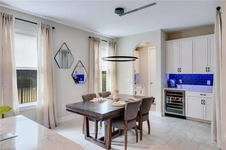 Dining room,wine cooler and arched walkways