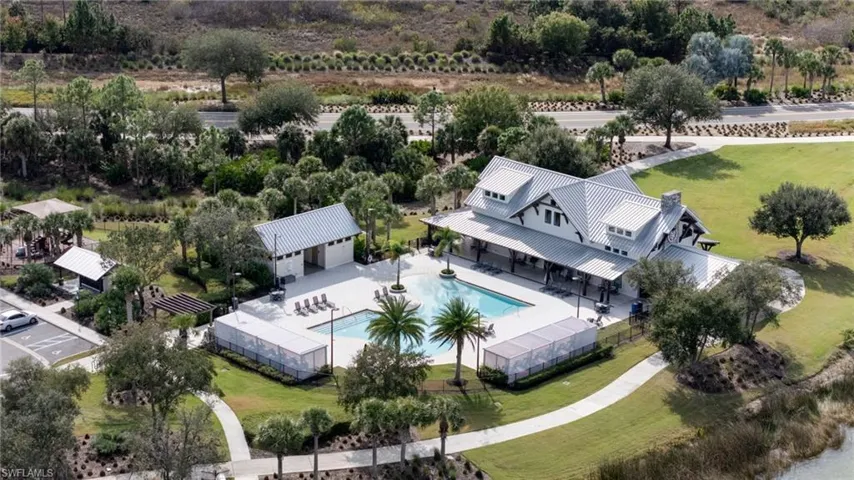 Aerial view of property and surrounding area with a pool area