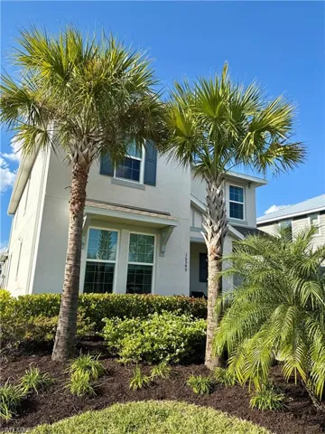 View of front of house featuring stucco siding