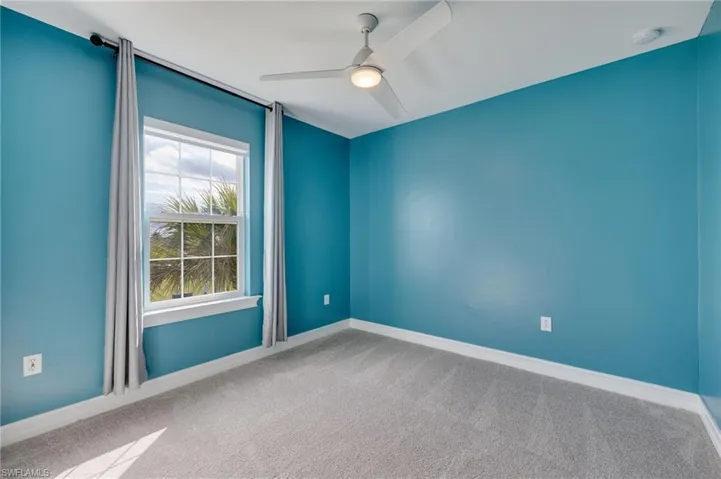 Bedroom #3 Carpeted with ceiling fan and baseboards
