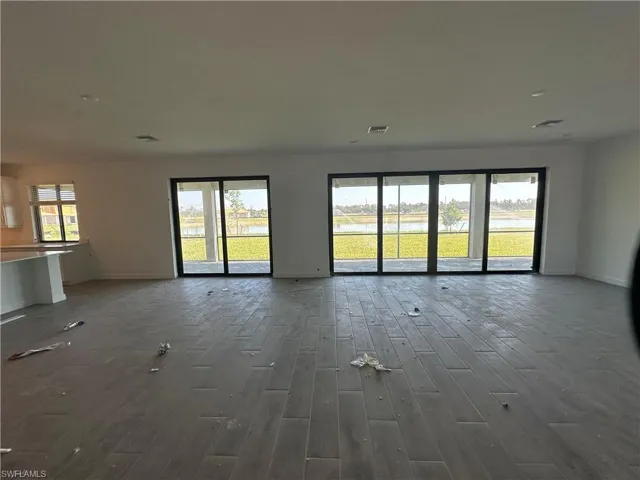 Unfurnished living room with hardwood / wood-style floors
