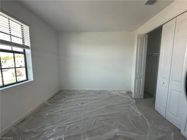 Unfurnished bedroom featuring a closet
