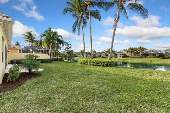 View of back yard and a water view