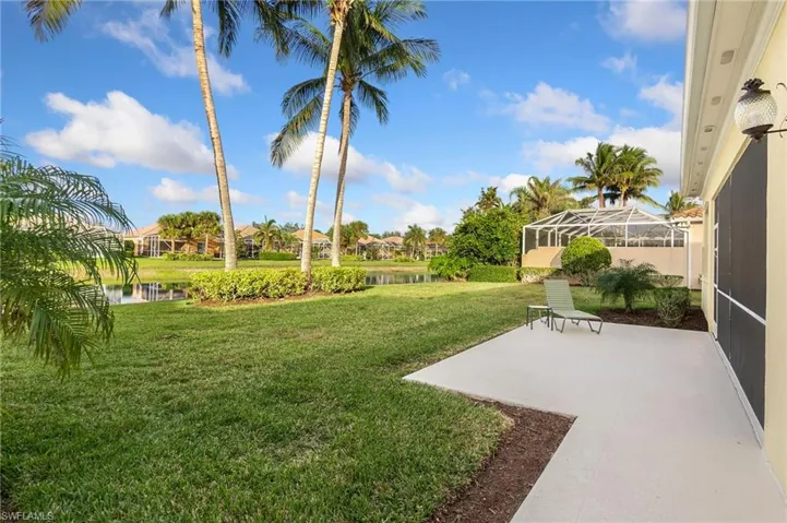 View of yard with a water view, and a patio area