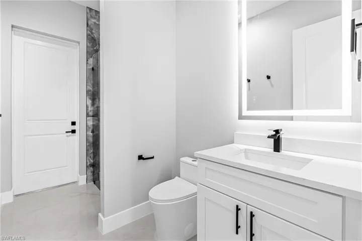 Bathroom featuring vanity and curtained shower