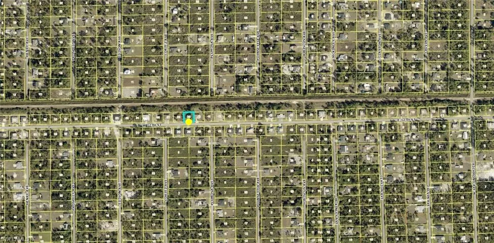 Aerial Map. Illustrating property parcels and a highlighted location within a developed area