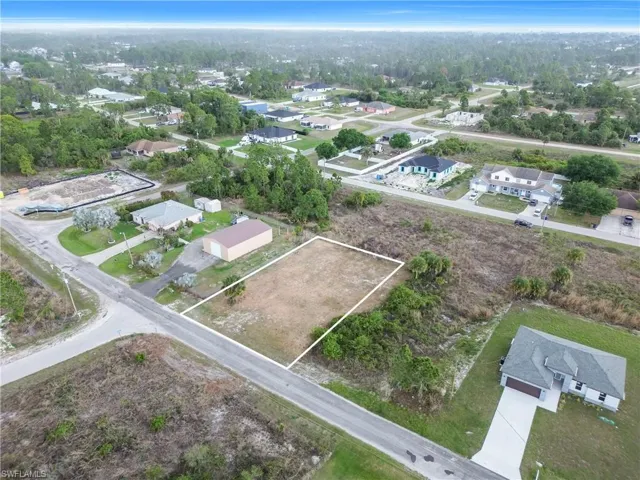 Aerial perspective of suburban area with property parcel outlined