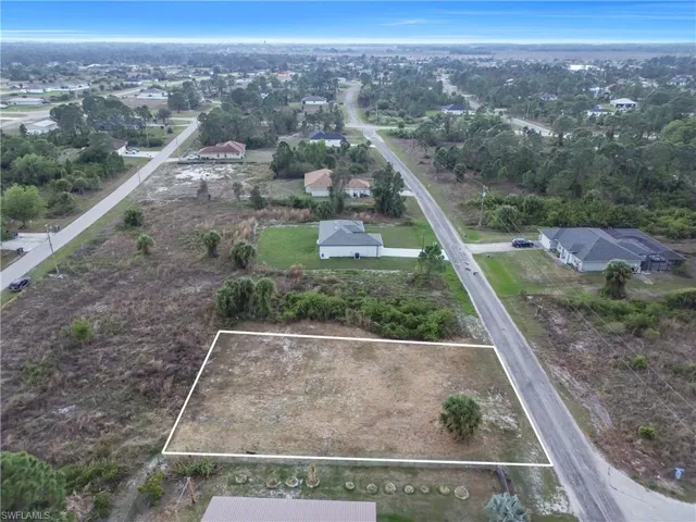 Aerial perspective of suburban area featuring property parcel outlined