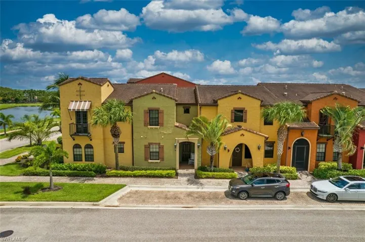 Mediterranean / spanish home featuring a tiled roof and stucco siding