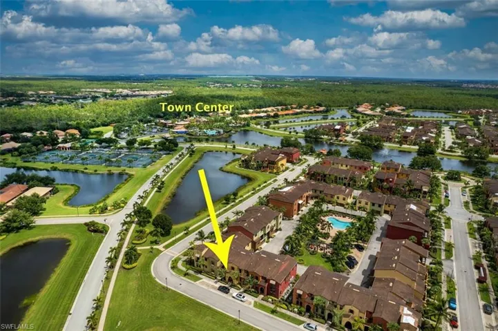 Aerial view of residential area featuring a large body of water