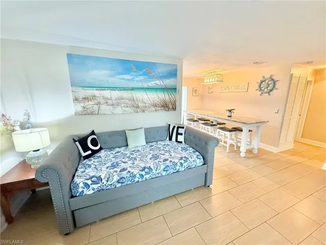 Bedroom featuring light tile patterned flooring