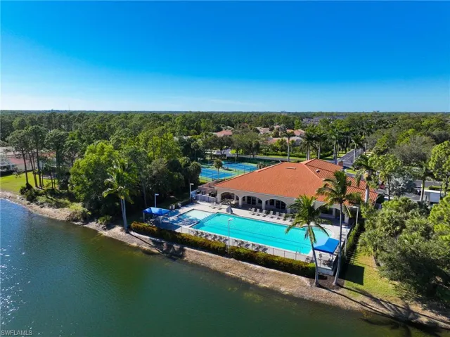 Birds eye view of the Community Pool and Amenities with a water view