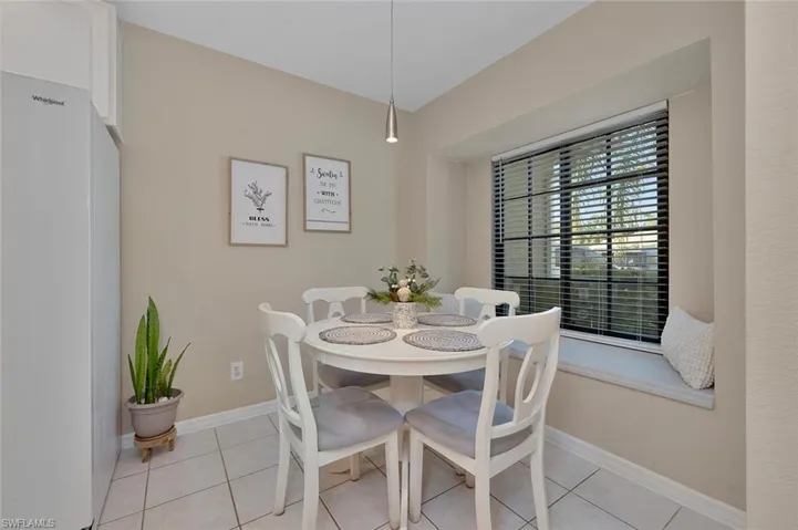 Dining area featuring light tile patterned flooring