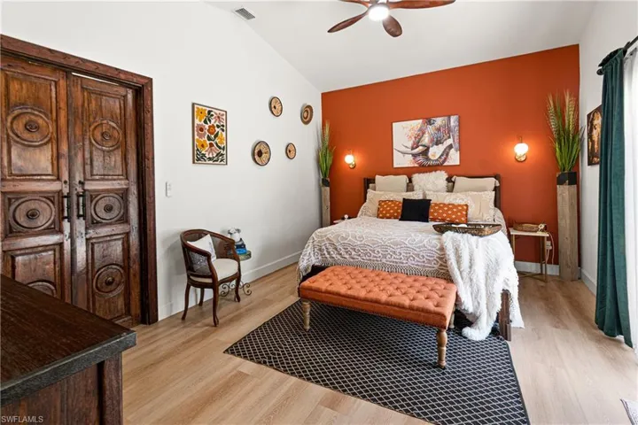 Vaulted ceilings complement the light wood-finish flooring