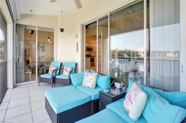 Sunroom / solarium featuring ceiling fan