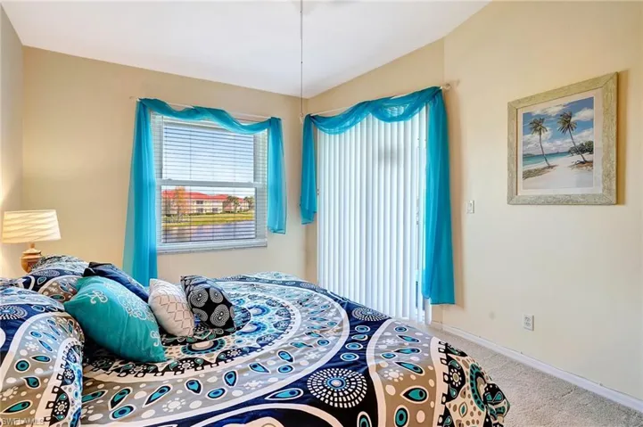 Bedroom with carpet and baseboards