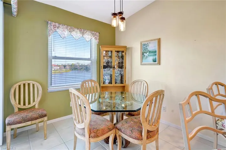 Tiled dining room with baseboards