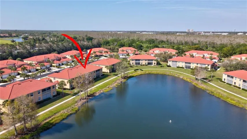 Drone / aerial view featuring a water view and a residential view