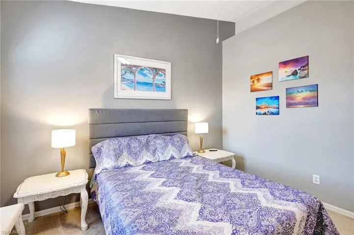 Carpeted bedroom with baseboards