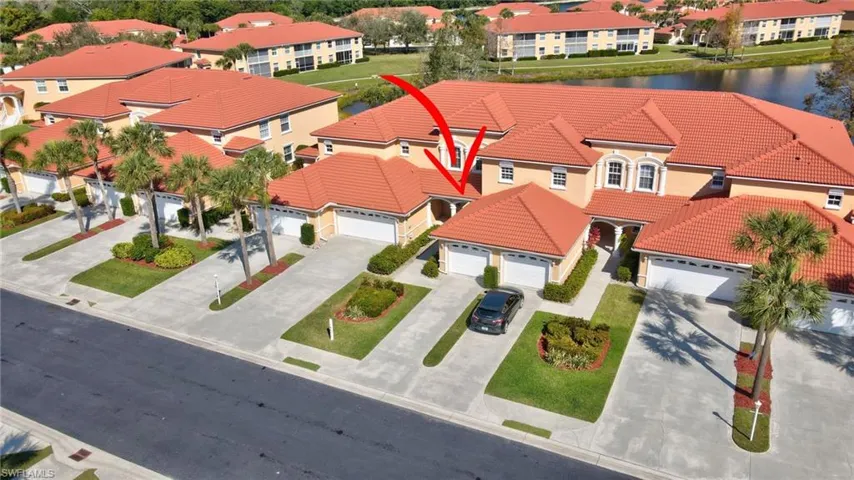 Drone / aerial view featuring a water view and a residential view