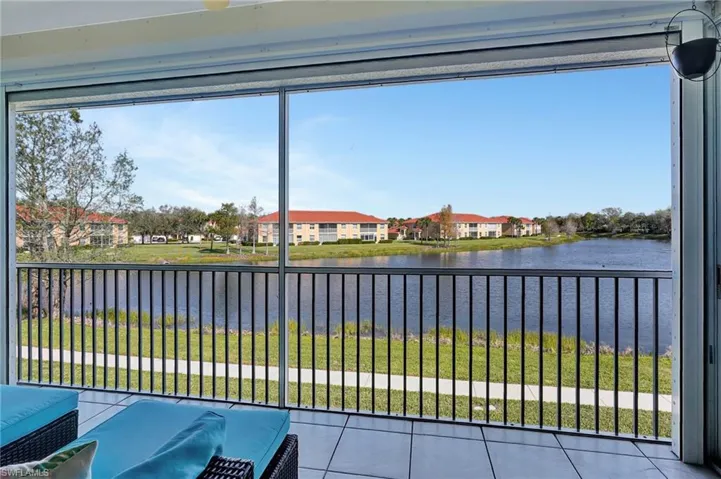 Unfurnished sunroom featuring a water view