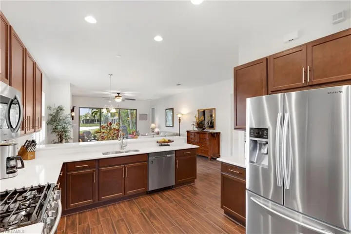 Dining room with dark hardwood / wood-style flooring