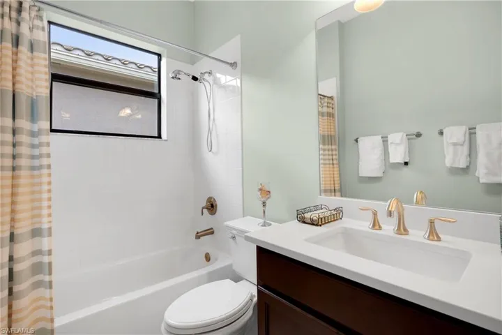 Clothes washing area featuring washer and dryer and sink