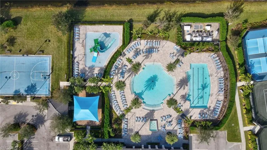 Aerial view of community amenities pickleball and tennis courts