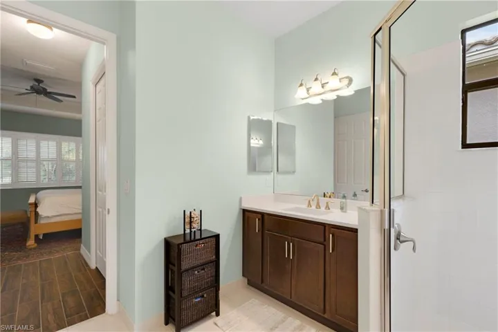 Den featuring ceiling fan and ornamental molding
