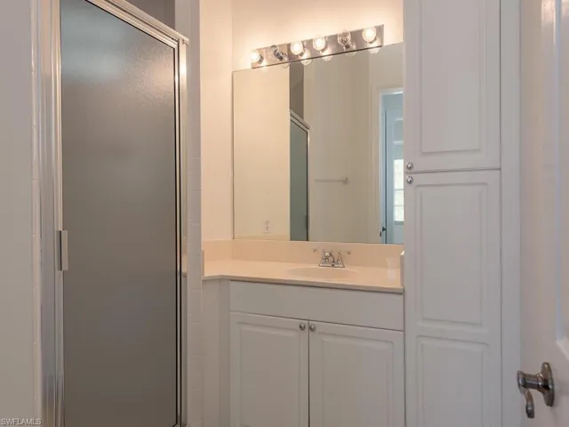 Guest bath featuring vanity and shower