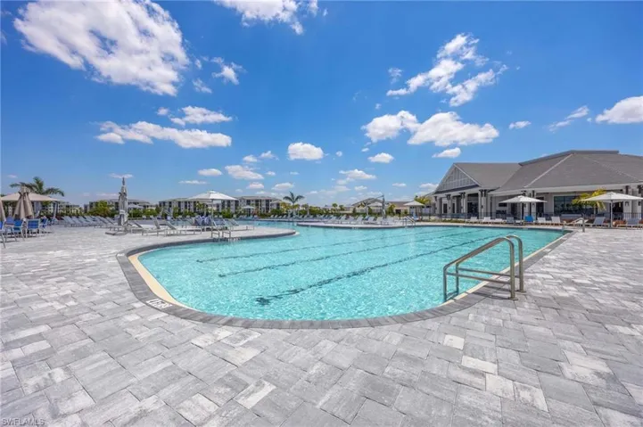Community pool with a patio area