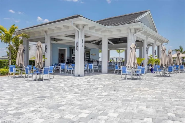 View of property's community with a patio and outdoor dining space