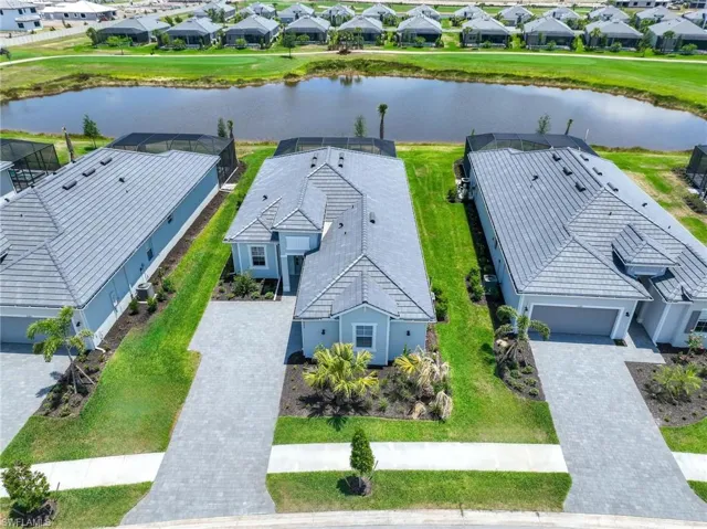 Drone / aerial view featuring a water view and a residential view