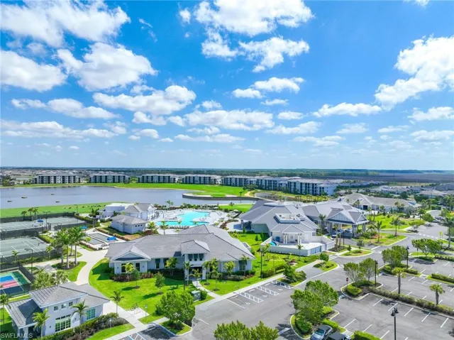 Birds eye view of property with a water view