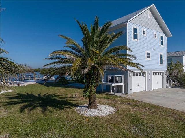 3 story stilt home with extra deep garages