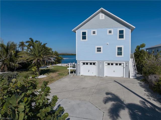 3 story stilt home with extra deep garages