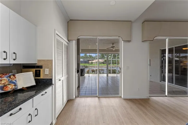 Kitchen opens to 4 seasons lanai