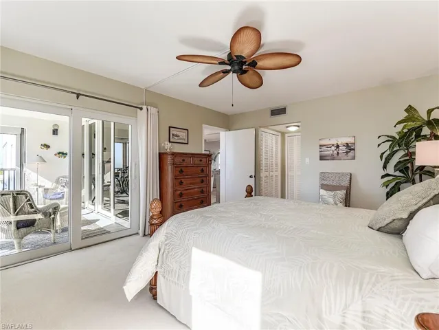 Bedroom with carpet floors, access to outside, a closet, and a ceiling fan