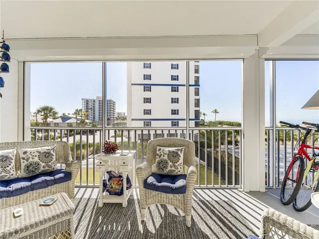 Balcony with a sunroom and an outdoor living space