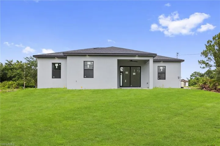 Spacious rear yard with a manicured lawn