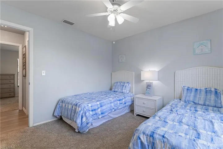 Bedroom with carpet floors and a ceiling fan