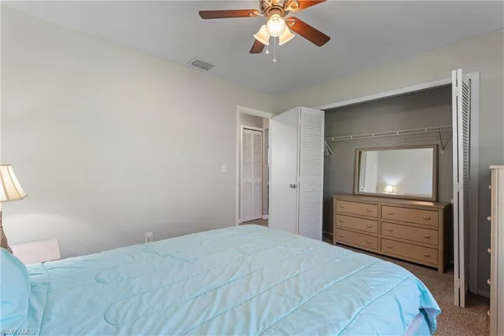 Bedroom with carpet and ceiling fan