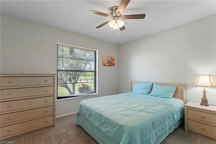 Bedroom featuring carpet flooring and a ceiling fan