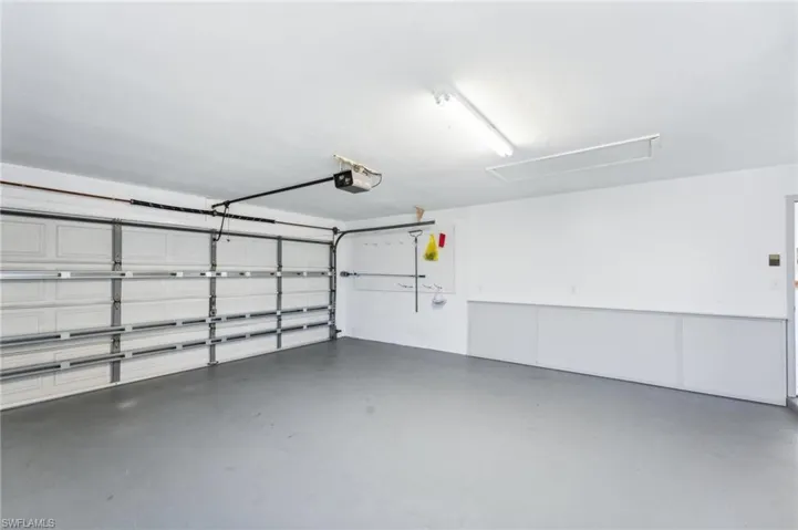 Garage featuring a garage door opener