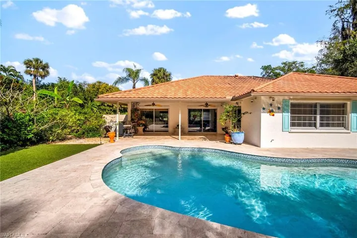 View of pool featuring ceiling fan and a patio