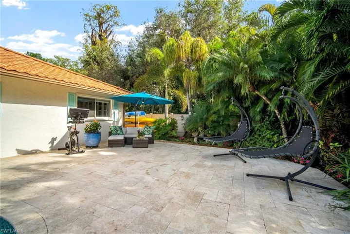 View of patio with an outdoor hangout area